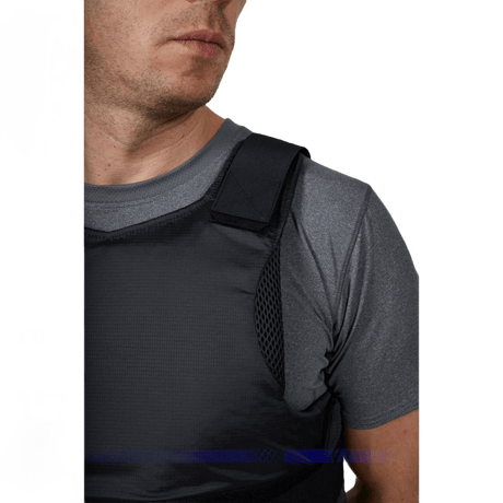 Anorak Rhodium® Concealable II Stab & Bulletproof Vest worn by man in grey shirt, showing discreet strong protection Level IIIA.