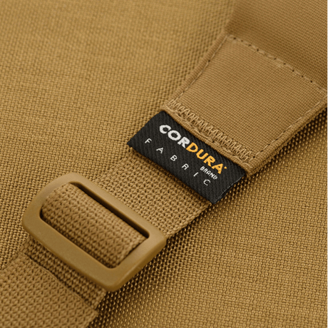 Close-up of a belt made of CORDURA® fabric focusing on the buckle and label.