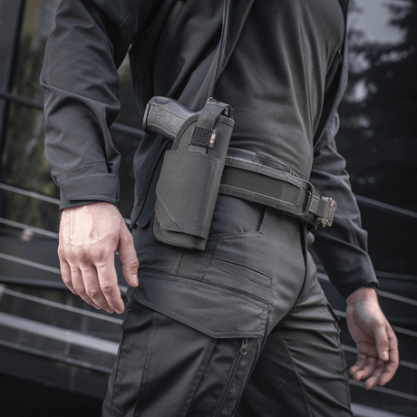 M-Tac Universal Tactical Holster Elite Right mounted on belt, fits Glock 17, adjustable strap and Velcro closure, MOLLE interface.