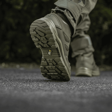 M-Tac Tactical Summer Boots Iva rear view while walking, focus on the robust sole, ideal for warm weather and tactical tasks.