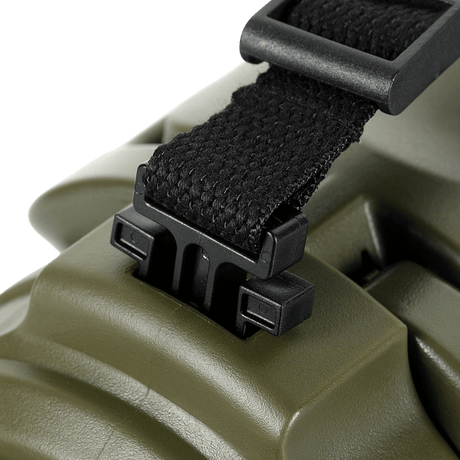 Close-up of a sturdy black strap fastened to a green surface with a plastic buckle, ideal for security and stability