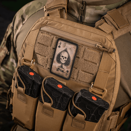 M-Tac Patch Ace of Spades on a military vest with vintage style, showing the spade ace skull design. Rugged Cordura 500D with Velcro mounting.