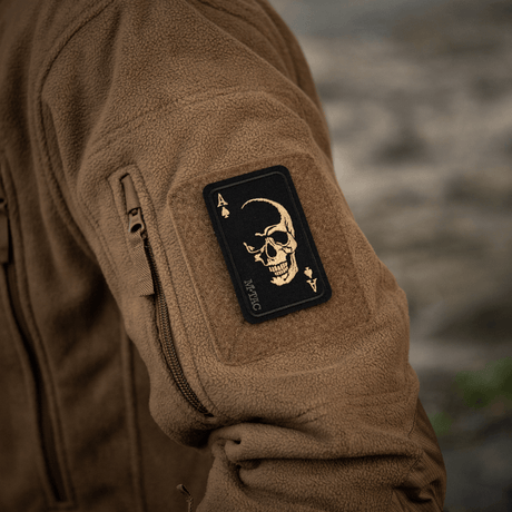M-Tac Patch Face of War (Embroidered) embroidered on Cordura 500D with skull symbol, inspired by Vietnam, attached with Velcro to a jacket.