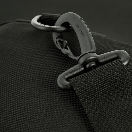 Close-up of adjustable strap on M-Tac Assistant Bag with sturdy buckle and MOLLE panels for versatile shoulder carry.