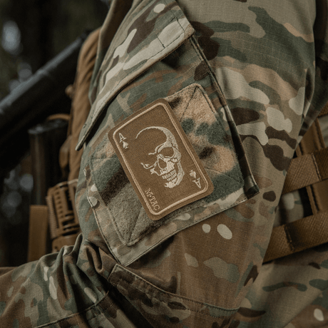 M-Tac Patch Face of War (Embroidered) embroidered skull symbol on an ace of spades card, Cordura 500D, attached with Velcro to camouflage clothing.