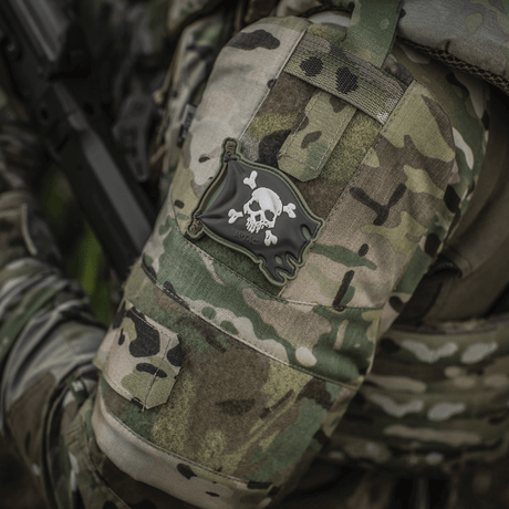 M-Tac Jolly Roger PVC on camouflage jacket, symbolizes adventurous spirit, 3D effect, Velcro attachment, 8x5 cm.
