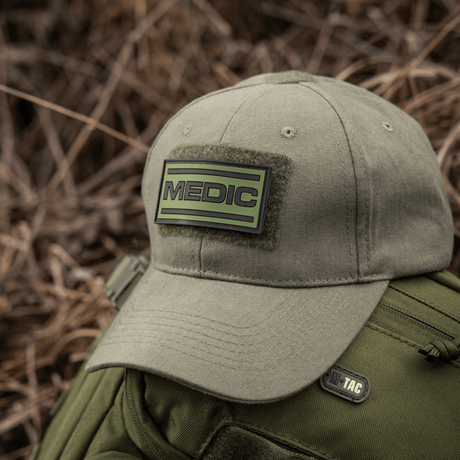 M-Tac Medic PVC 3D patch on green cap, medical velcro patch with 3D effect, attachable to uniforms and bags. PVC, size: 70x35mm.