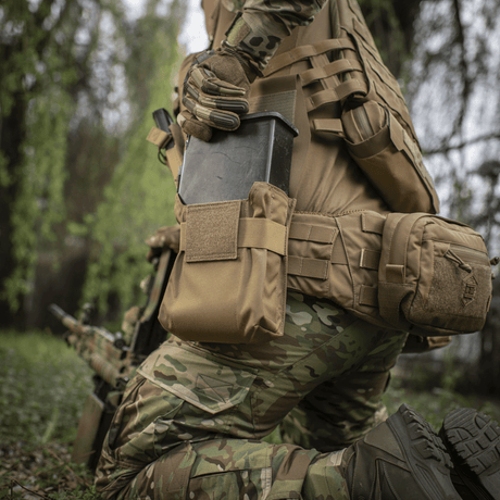 Soldier with M-Tac Pouch for M249 Cartridge Box Closed in natural surroundings