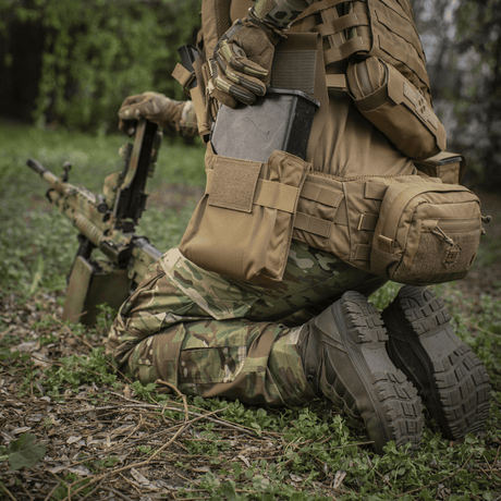 M-Tac Pouch for M249 Cartridge Box Closed mounted on tactical gear during an operation in a woodland area
