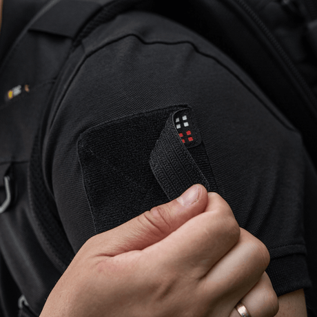 M-Tac Patch Flag 25x80 Mini Squares attached to clothing with velcro, made of durable Cordura 500D, shows tactical use.