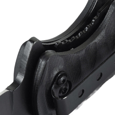 Close-up of handle and locking mechanism on M-Tac Outdoor & Military folding knife - Type 4 with durable G10 composite.