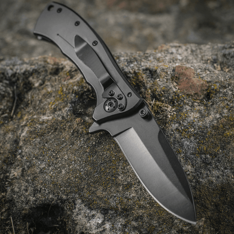 M-Tac Outdoor & Military folding knife - Type 7 on a rock, aggressive design and chrome stainless steel for tactical use.