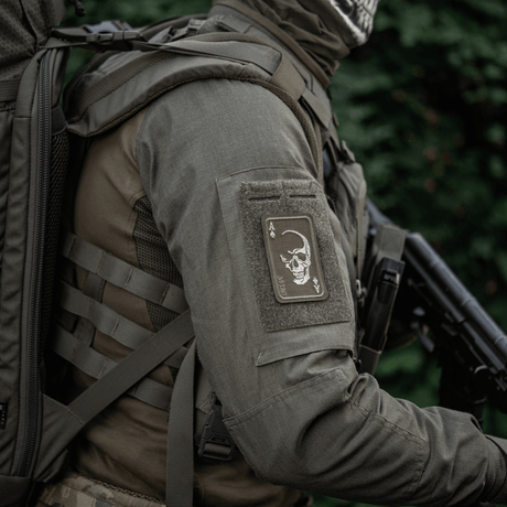 M-Tac Patch Face of War (Embroidered) in Cordura 500D with skull and ace of spades motif, attached with Velcro to a tactical jacket.