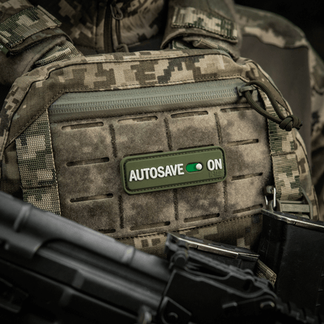 M-Tac Autosave 3D PVC patch on tactical vest, shows camouflage detail and easy attachment, 8x2.5 cm, full color
