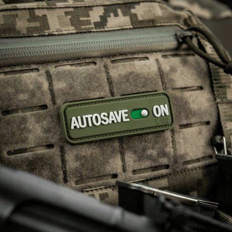 M-Tac Patch Autosave PVC 3D morale patch on a camouflage backpack, PVC, 8 x 2.5 cm, full color with Velcro backing.