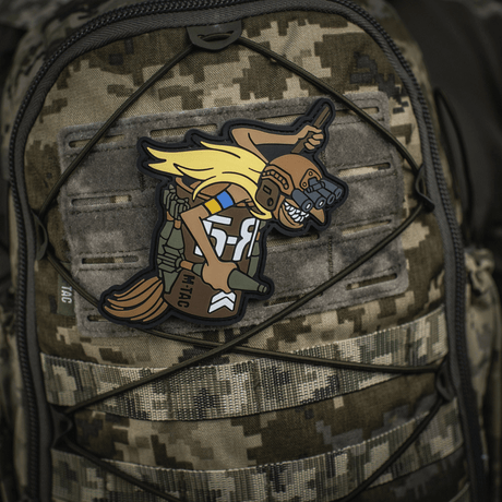 M‑Tac Patch Baba-Yaga Vertical on camouflage backpack, depicting a UAV operator with night-vision goggles and grenades, inspired by Ukrainian UAV teams.