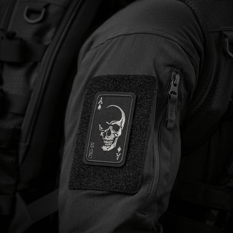 M-Tac Patch Face of War (Embroidered) on jacket sleeve with skull symbol inspired by the "card of death" from the Vietnam War, embroidered on Cordura 500D.