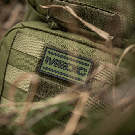 M-Tac Medic PVC 3D on olive-colored backpack. Tactical medical patch in flexible PVC with 3D effect for visibility.