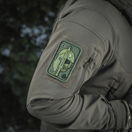 M-Tac Patch Molon Labe 3D PVC rubber patch mounted on a jacket with Velcro, tactical Spartan-inspired design, 108 x 68 mm