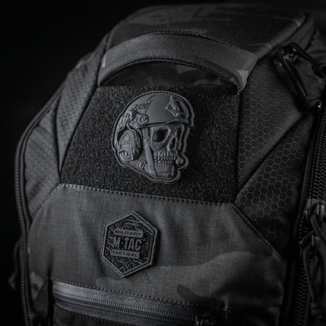M-Tac Patch Operator 3D PVC mounted on a tactical backpack with Velcro, realistic design, suitable as a morale patch. Size: 6 x 7 cm.