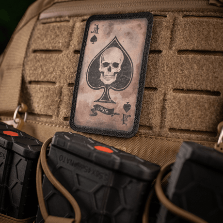 M-Tac Patch Ace of Spades morale patch with skull motif on a bag, symbolizing fighting spirit and style. Cordura 500D, Velcro mounting.