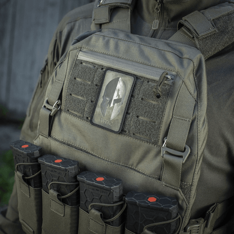 M-Tac Spartan Helmet Patch on a tactical vest, symbolizes courage and strength, made from Cordura 500D with a vintage look and Spartan helmet.
