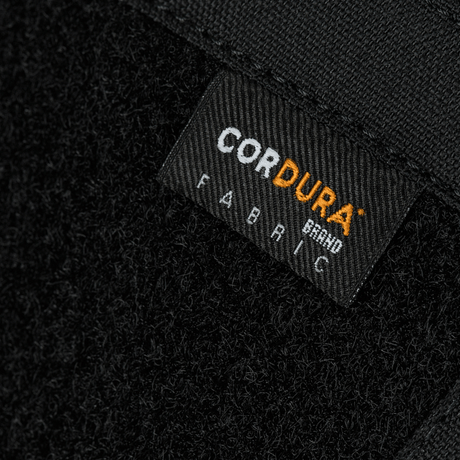 Close-up of Cordura fabric label on M-Tac Sphaera Hardsling Bag Large Elite with Velcro, made from durable materials.