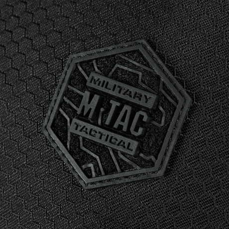 Close-up of M-Tac Sphaera Hex Hardsling Bag Large Elite with hexagonal logo on black background.