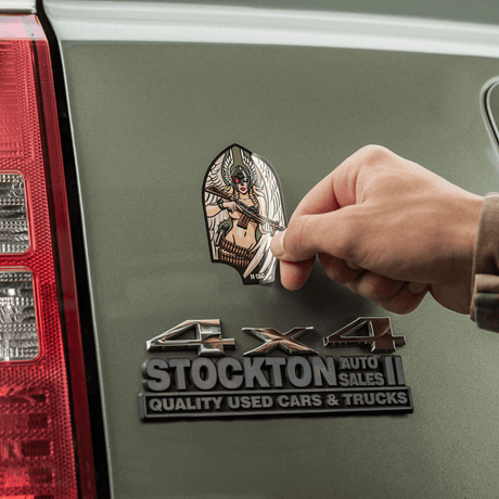 M-Tac Valkyrie sticker on a car, shows a war goddess with M4 rifle shaped like an Arrowhead patch, symbol of the First Special Service Force.
