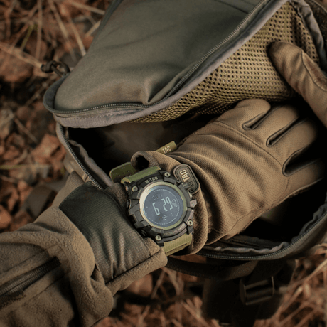 M‑Tac Tactical Adventure Watch in use during outdoor activities, rugged design with advanced features for outdoor enthusiasts.