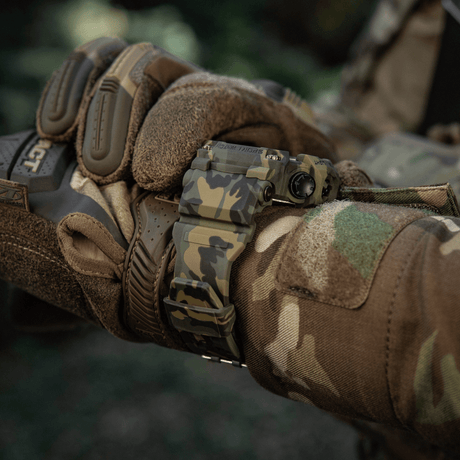 M-Tac Tactical Watch 2037 shown on a hand with a camouflage glove, suitable for tactical and outdoor use.