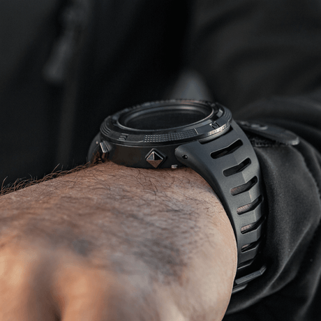M-Tac Tactical Watch 2147 with rugged design on a man's wrist, ideal for outdoor and tactical use.