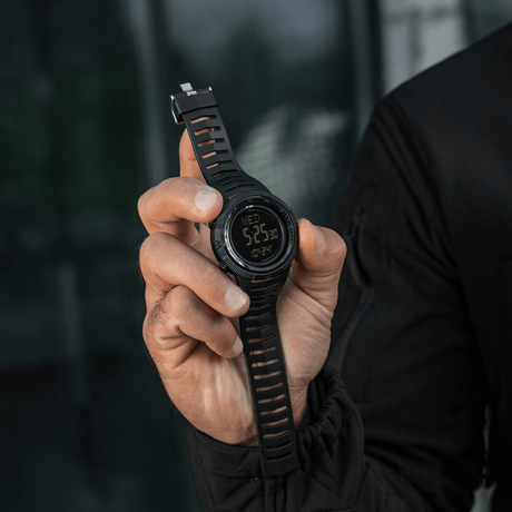 M-Tac Tactical Watch 2147 held by person, showing rugged design for tactical or everyday use, with features like compass and LED light.