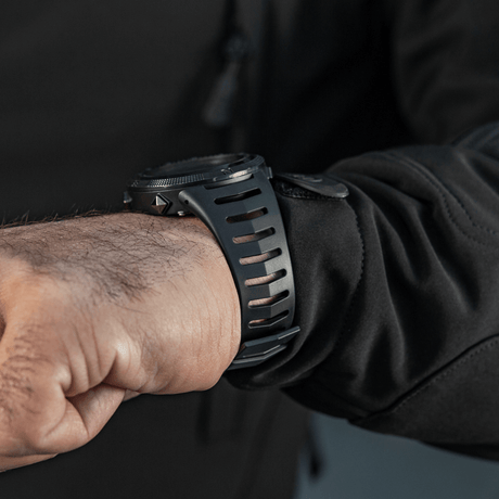 M-Tac Tactical Watch 2147 on wrist, rugged ABS plastic design, ideal for tactical and outdoor use, with features like compass and LED lighting.