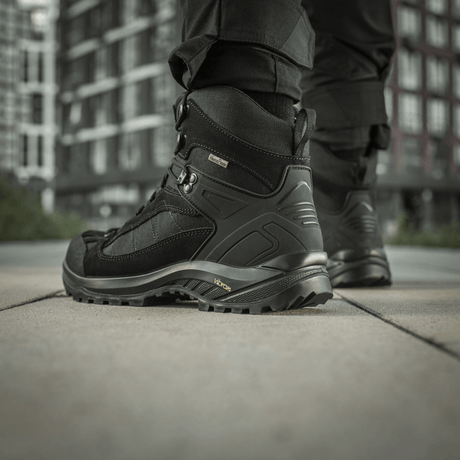 M-Tac Tactical Demi-Season Boots Pro Line with strong Vibram sole in urban setting – durable and moisture-resistant design for tactical tasks.
