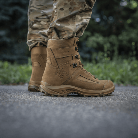 Close-up of M-Tac Tactical Summer Boots on a man in camouflage pants, made of leather and Cordura® mesh. Suitable for warm days.