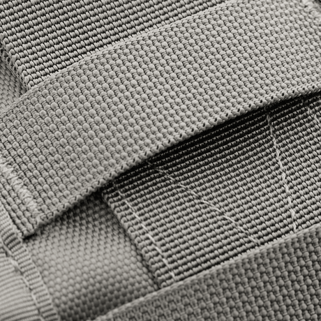Detail of M-Tac Urban Line City Patrol bag with strong 600D polyester and PVC coating, showing durable straps for a sling bag design.