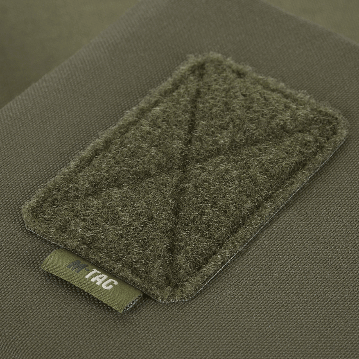 M-Tac Utility Taske Elite Small i Cordura 500D med Laser Cut MOLLE-system, tæt på visning af forstærket panel.