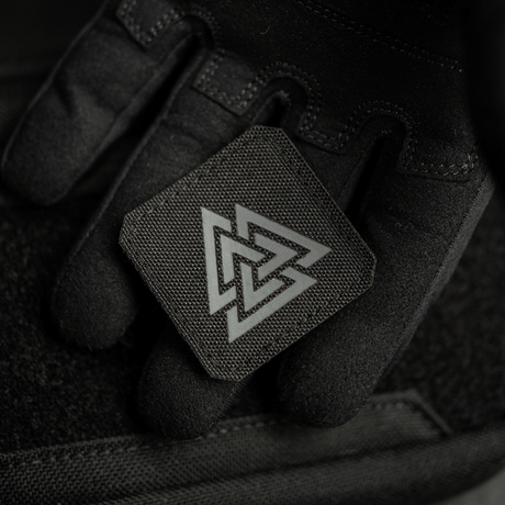 M-Tac Patch Valknut Laser Cut Odin symbol in black, held in a black glove, showing the Valknut symbol details.