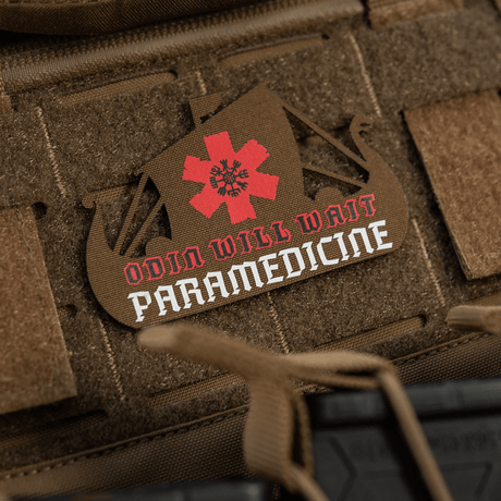 M-Tac Patch Viking Evac in brown shaped like a ship, with red paramedic star and text on a tactical backpack.