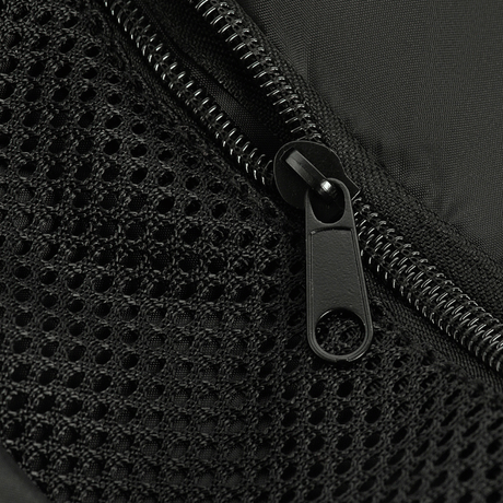 Close-up of zipper detail on M-Tac Assistant Bag with heavy stitching on black material.