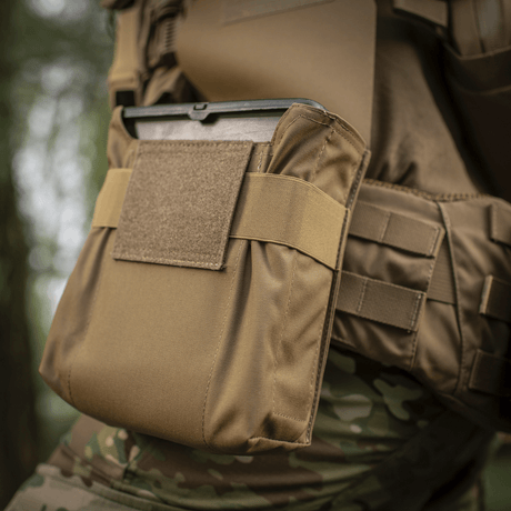 M-Tac Pouch for M249 Cartridge Box Closed mounted on a tactical vest in woodland areas
