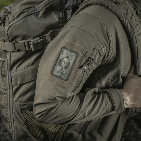 M-Tac Patch Ace of Spades mounted on a jacket, Cordura 500D material, vintage look, symbol of fighting spirit and clarity, Velcro mounting.