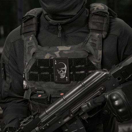 M-Tac Patch Face of War (Embroidered) worn on tactical vest, featuring skull and ace of spades symbol, Cordura 500D, inspired by the Vietnam War.