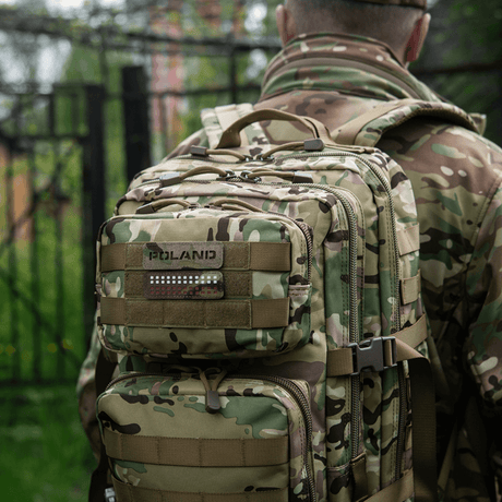 M‑Tac Patch Poland End-to-End 25x80 on a camouflage backpack in nature, Cordura 500D with Velcro attachment.
