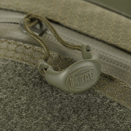Detail of M-Tac Sling Pistol Bag Elite Hex with Velcro zipper and textile texture.