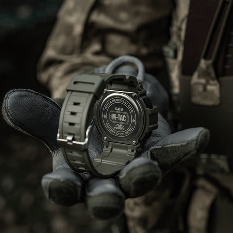 M-Tac Tactical Watch with Compass 2233 in military style, shown on a gloved hand, suitable for outdoor and tactical use, waterproof to 5ATM.