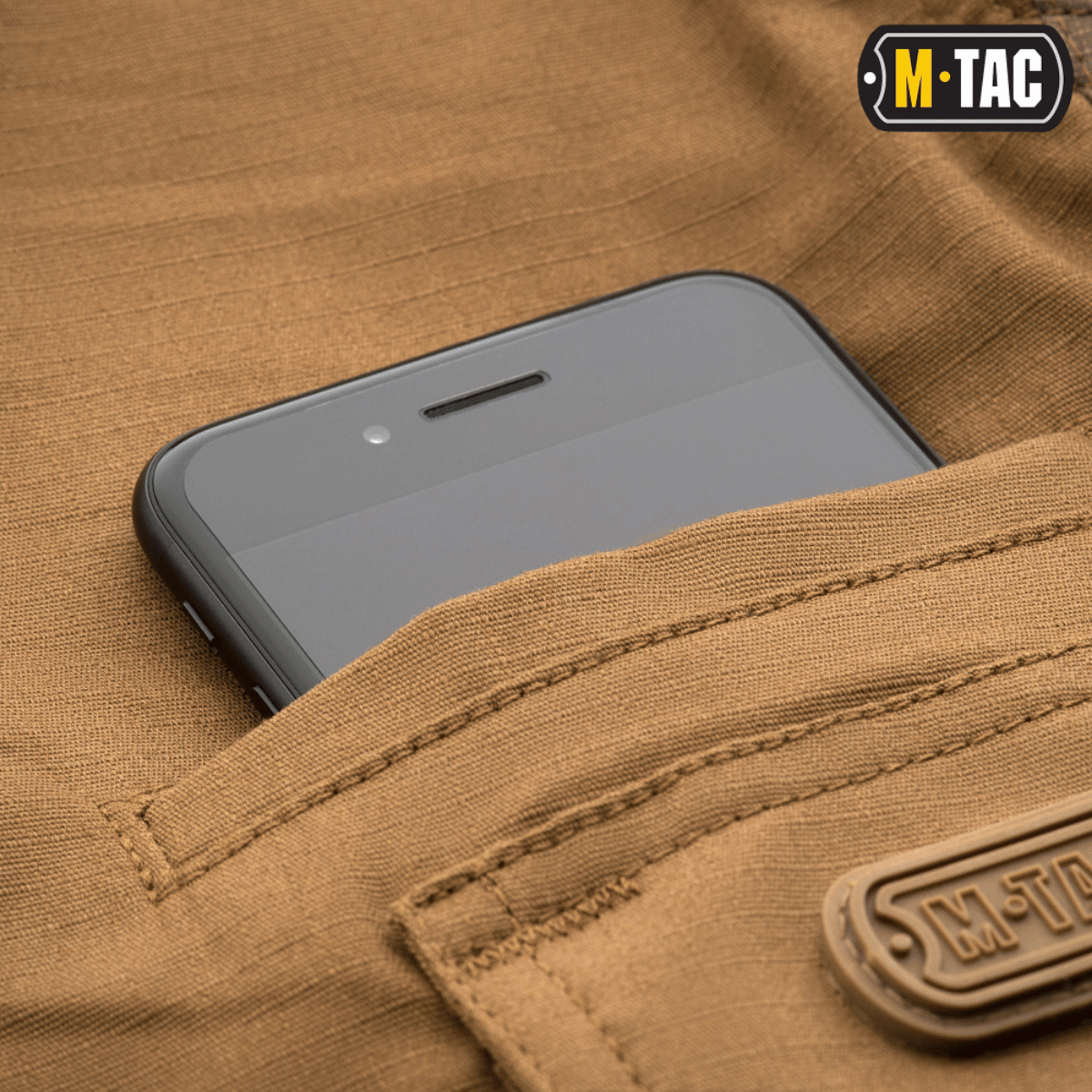 M-Tac Taktiske Bukser Aggressor Gen. II Flex med telefon i lommen, lavet af rip-stop stof med Teflon-belægning til alsidig brug.