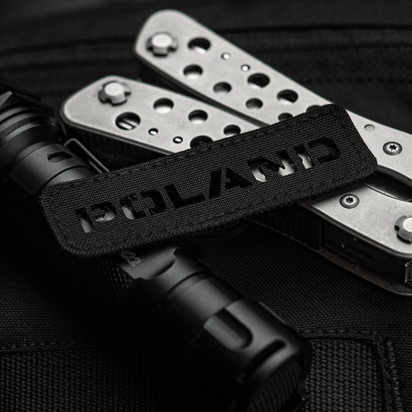 M‑Tac Patch Poland End-to-End 25x80 perforated Cordura 500D patch with laser-cut design, attached to gear with Velcro.