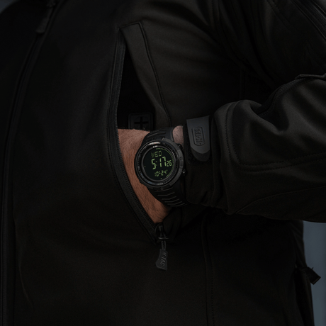 M-Tac Tactical Watch 2147 in use, combining rugged design with practical features like compass and LED backlight.